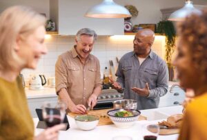 Older friends cooking and talking together