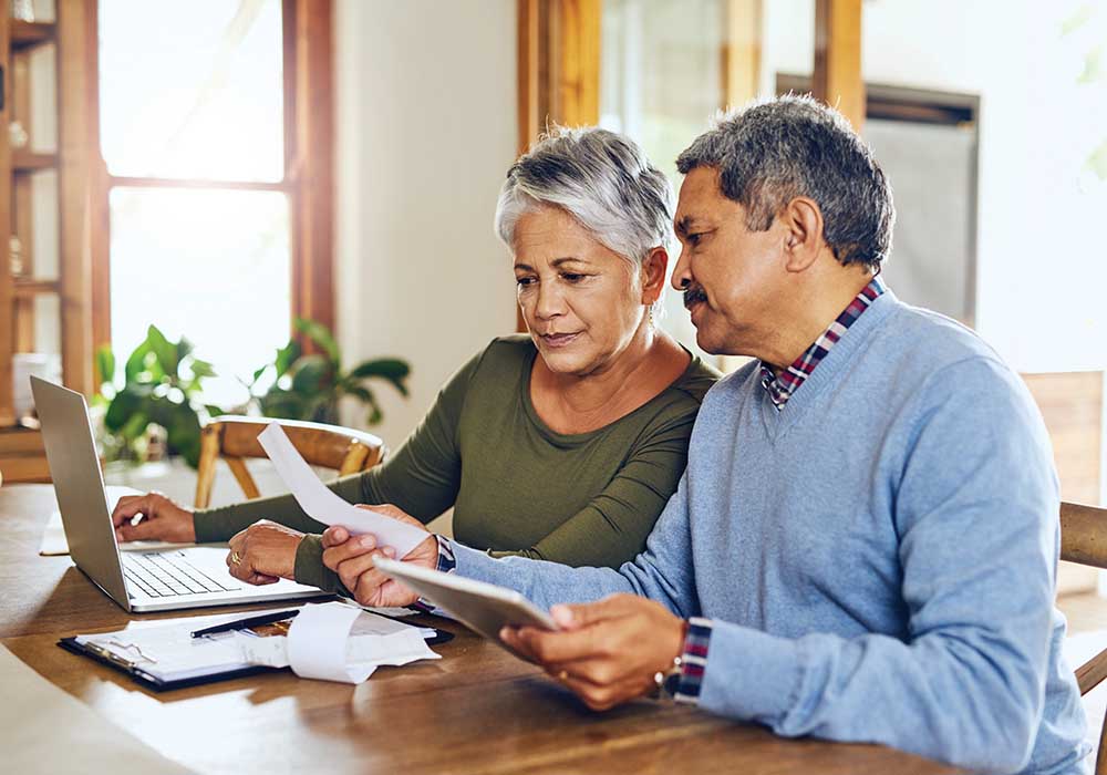 Older couple reviewing bills at home